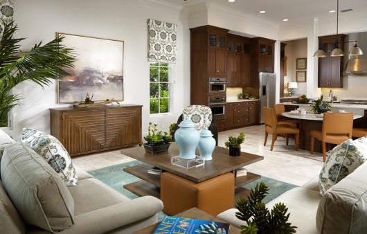 The family room and breakfast peninsula shows off the subdued and elegant interior design from Romanza.