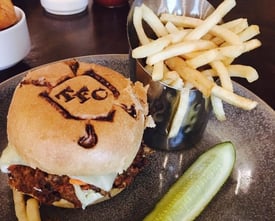 a delicious burger in the Grille Room of The Founders Club
