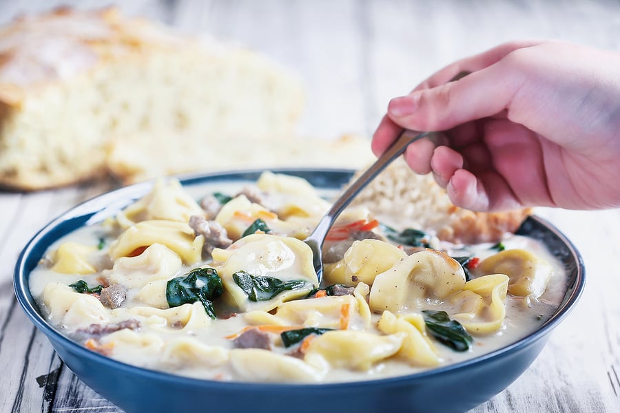 bigstock-Hand-With-Tortellini-Soup-With-409524910